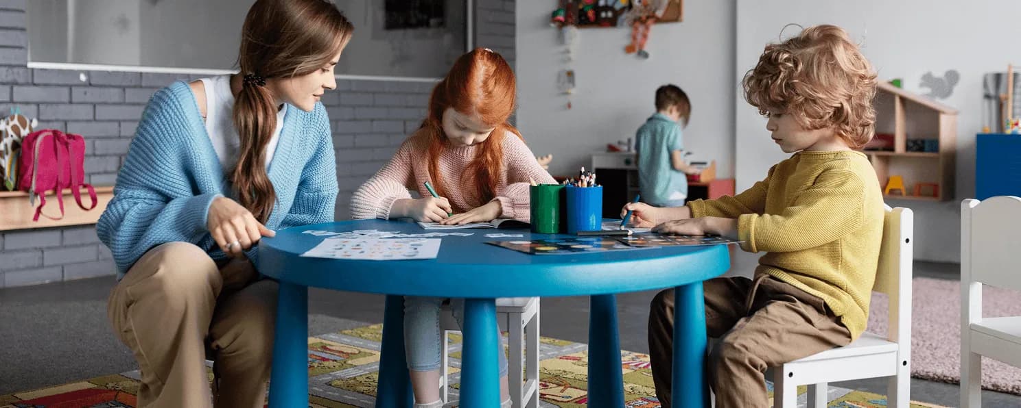 A teacher working one to one with a young child